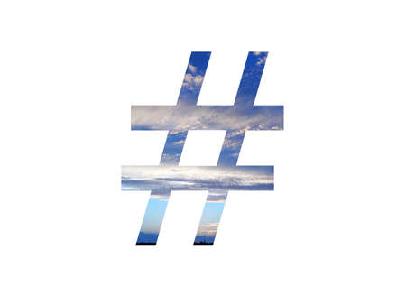 hashtag sign of the alphabet made with a blue sky with clouds and a black horizon