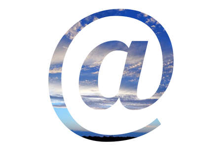 mail sign, at sign of the alphabet made with a blue sky with clouds and a black horizonの写真素材