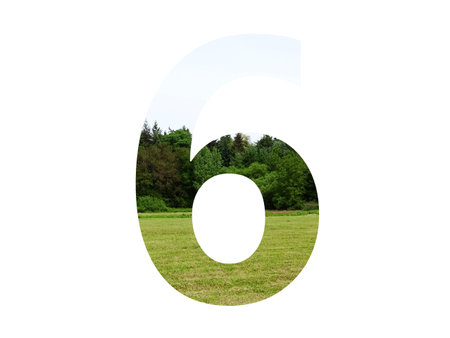 number 6 of the alphabet made with landscape with grass, forest and a blue sky, isolated on a white backgroundの写真素材