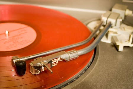 recordplayer with red lp records (33 1/3 rpm)