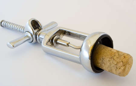 The corkscrew with cork isolated on whiteの写真素材