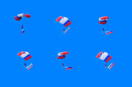 Parachuting with russian flag in blue sky. Collageの写真素材