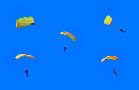 Parachuting in blue sky. Collage.の写真素材