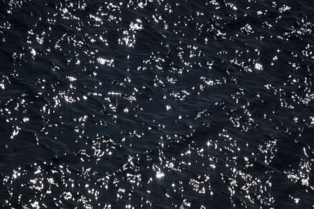 Sun reflections on the rippled water surfaceの写真素材