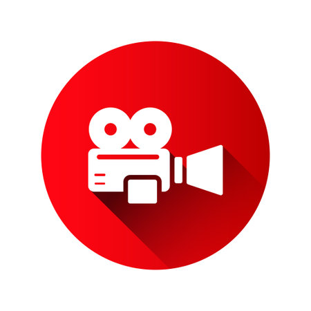 Vintage video camera in flat style on red circle with shadow isolated on white backgroundのイラスト素材