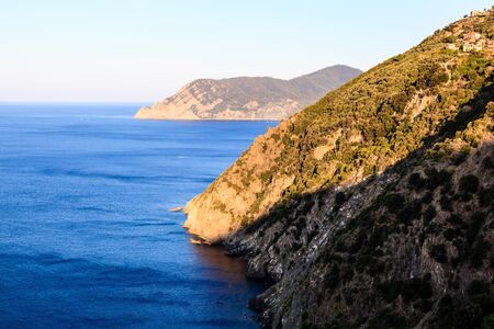 The Wild and Rocky Coast near Village of Corniglia in Cinque Terre, Italyの写真素材