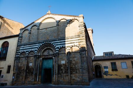 Ornate White and Black Church in Volterra, Tuscany, Italyの写真素材