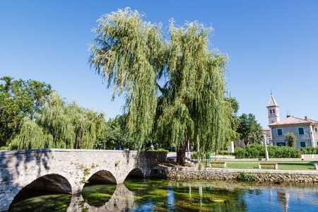 Picturesque Landscape, Church, Bridge, River and Willow, Solin, Croatiaの写真素材