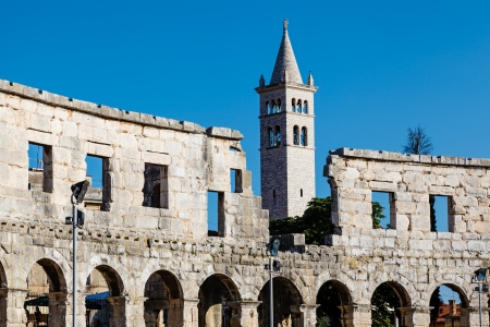 White Church and the Ancient Roman Amphitheater in Pula, Istria, Croatiaの写真素材