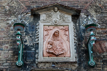Madonna and the Child Relief in Siena, Tuscany, Italyの写真素材