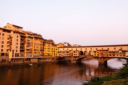 Ponte Vecchio Bridge Across Arno River in Florence at Morning, Italyの写真素材