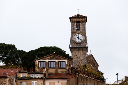 Bell Tower and Clock of Notre Dame clock Church in Cannes, France