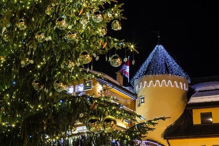 Illuminated and Decorated Christmas Tree on Central Square of Megeve in French Alps, Franceの写真素材