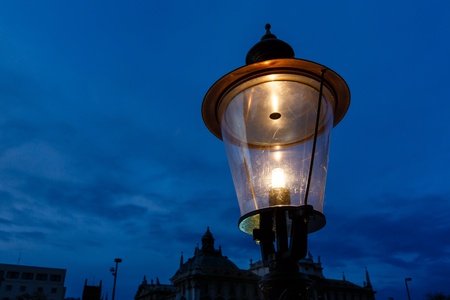 Vintage Illuminated Street Lamp in the Center of Munich, Germanyの写真素材