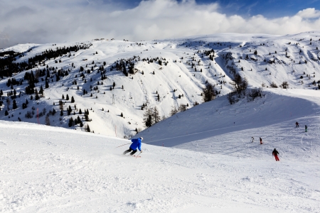 Skiers in Passo Campolongo near Skiing Resort of Arabba, Dolomites Alps, Italyの写真素材