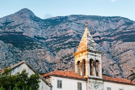 Medieval Bell Tower and Biokovo Mountains in the Background, Makarska, Croatiaの写真素材