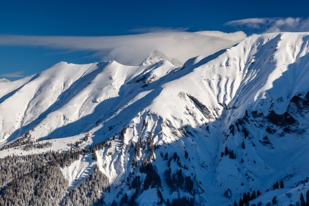 Mountain Peak and Ski Slope near Megeve in French Alps, Franceの写真素材