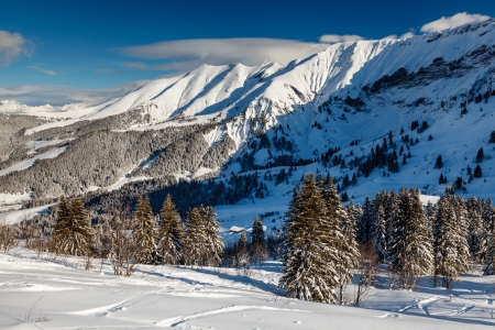 Mountain Peak and Ski Slope near Megeve in French Alps, Franceの写真素材