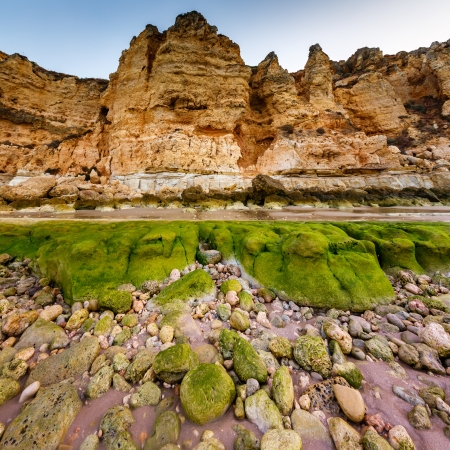 Rocks and Cliffs of Porto de Mos Beach in the Morning, Lagos, Algarve, Portugalの写真素材