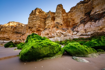 Rocks and Cliffs of Porto de Mos Beach in the Morning, Lagos, Algarve, Portugalの写真素材
