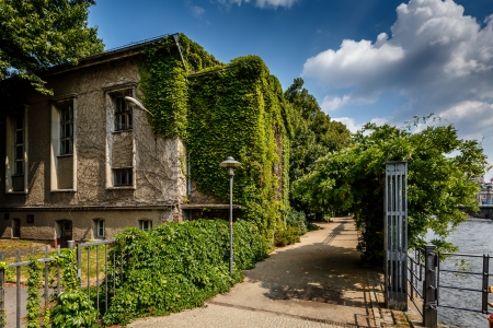 River Spree Embankment and House with Grape Vines, Berlin, Germanyの写真素材