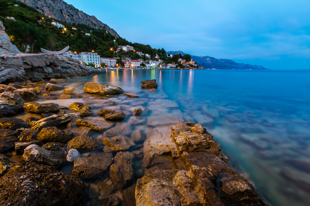 Rocky Beach and Small Village near Omis in the Evening, Dalmatia, Croatiaの写真素材