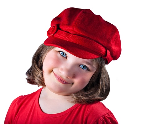 Young blue-eyed girl posing with a red hatの写真素材