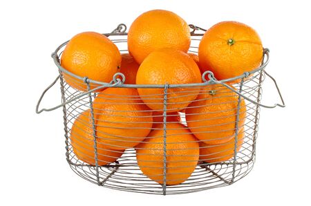 Oranges in a basket isolated on whiteの写真素材