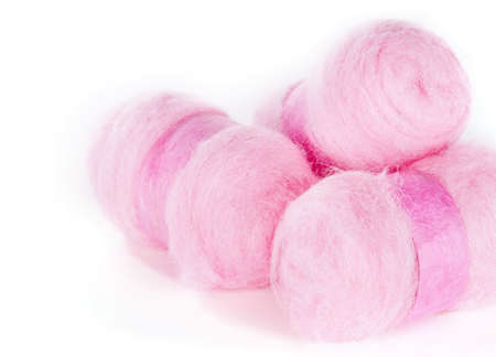 Balls of pink wool isolated on white backgroundの写真素材