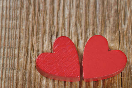 Two red hearts on rustic wooden background with copy spaceの写真素材