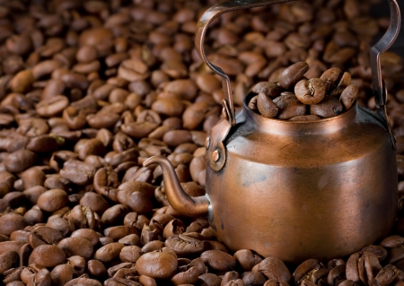 Coffee pot with light roasted coffee beans, selective focusの写真素材