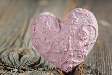 Pink heart on wooden background, selective focusの写真素材