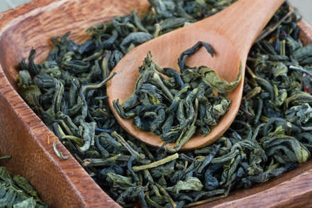 Wooden spoon and green tea, closeupの写真素材