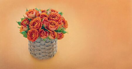 Bouquet of orange roses on textured background with copy spaceの写真素材
