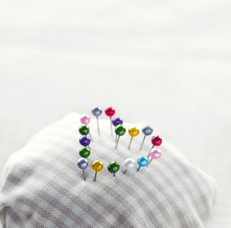 Heart of pins in a pincushionの写真素材