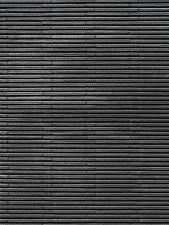 Dark tile texture brick wall surfaced