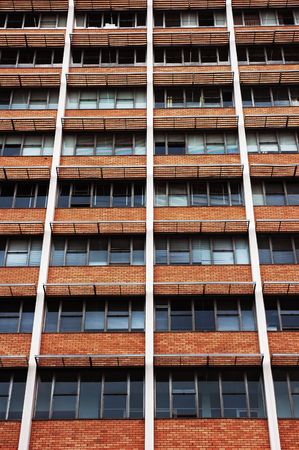 buiding facade with window read and brown brick wall
