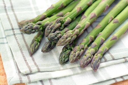 Organic asparagus on table clothの写真素材