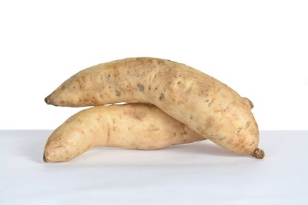 Two sweet potatoes on tableの写真素材