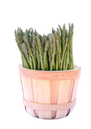 A lot of asparagus in bucket isolate on whiteの写真素材