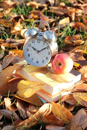 book, clock, apple, and Fall seasonの写真素材
