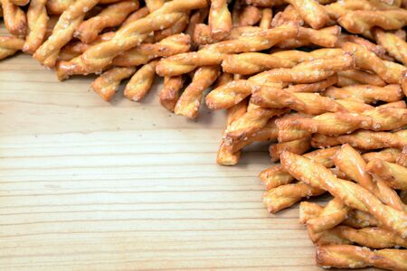 Pretzel sticks on wooden table