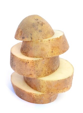 chopped potatoes on pile on white backgroundの写真素材