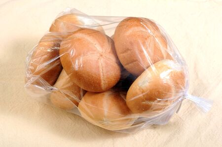 round bread buns in plastic bag for breakfast