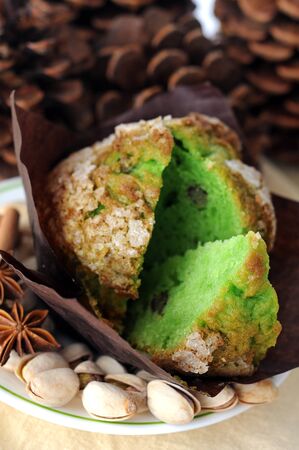 muffin and pistachio on napkinの写真素材