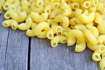 a pile of tube pasta on grunge backgroundの写真素材