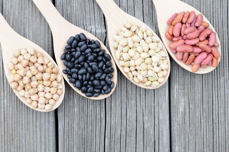 black, light red, chick pea,  lablab beans on grunge tableの写真素材