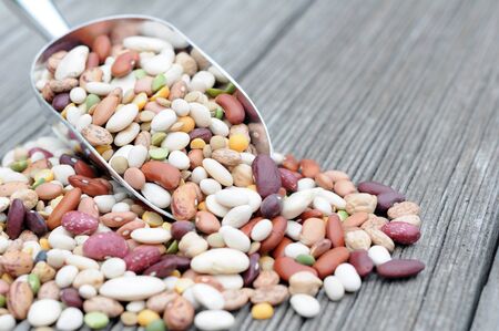 mixed bean on metal scoop on grunge table