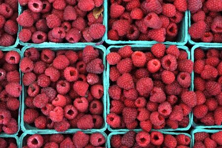 raspberries in basket at market place