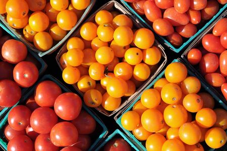 grape tomato in bucket in outdoor market placeの写真素材
